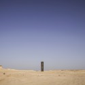 Richard Serra's East-West/West-East Rises in the Qatari Desert “East-West/West-East” / Richard Serra. Image © Nelson Garrido