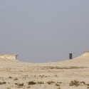 Richard Serra's East-West/West-East Rises in the Qatari Desert “East-West/West-East” / Richard Serra. Image © Nelson Garrido