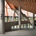 AD Classics: Limoges Concert Hall / Bernard Tschumi Architects AD Classics: Limoges Concert Hall / Bernard Tschumi Architects The mass of the auditorium is distributed onto thin columns that penetrate the foyer. Image Courtesy of Bernard Tschumi Architects