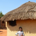 Why I Created a Database to Document African Vernacular Architecture Swaziland child standing in front of home. Image © Jon Sojkowski via Swaziland Architecture